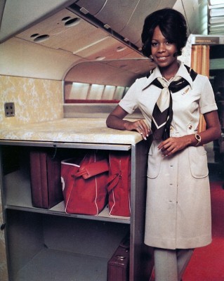 Carry-on luggage compartments helped to compensate for the lack of centerline overhead storage. (TWA)